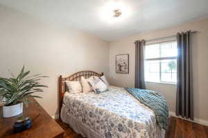 Bedroom featuring dark wood-type flooring