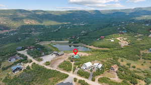 View of property location featuring a water and mountain view