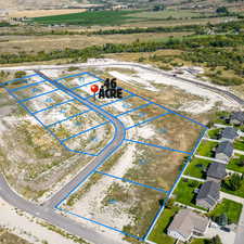 Aerial view of sparsely populated area featuring property boundaries highlighted