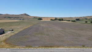 View of mountain backdrop with rural landscape