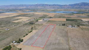 View of rural area featuring property boundaries highlighted and a water and mountain view