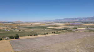 View of mountain background with a nearby body of water and rural landscape