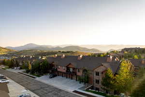 View of mountain backdrop with nearby suburban area