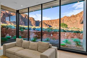 Sunroom / solarium with healthy amount of natural light and a mountain view