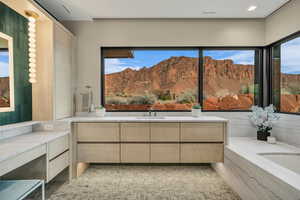 Full bathroom featuring a bath, a mountain view, and vanity