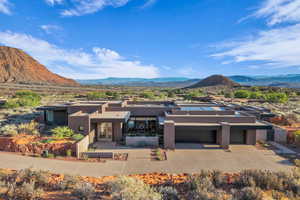 View of front of property with a mountain view and stucco siding