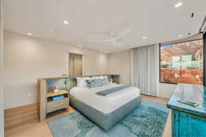 Bedroom with light wood-style flooring, recessed lighting, and a ceiling fan