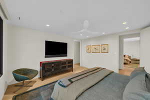 Bedroom featuring wood finished floors, recessed lighting, and a ceiling fan