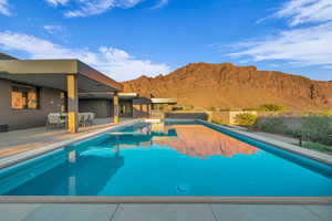View of pool featuring a mountain view and a patio area