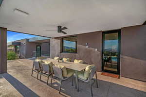 View of patio with a ceiling fan and outdoor dining area