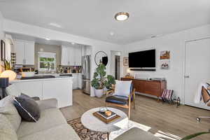 Living area featuring light wood-style flooring