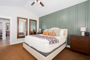 Bedroom with lofted ceiling, carpet floors, and ceiling fan