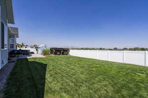 Fenced backyard featuring a patio area