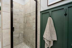 Full bathroom featuring a stall shower