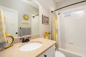 Full bathroom with vanity and shower / tub combo