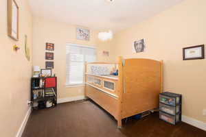 Carpeted bedroom with baseboards