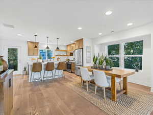 Dining area featuring light wood-style flooring and recessed lighting