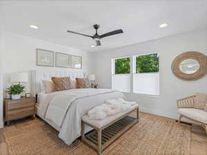 Bedroom with wood finished floors, recessed lighting, and ceiling fan