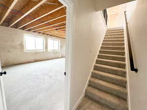 Stairway with unfinished concrete floors