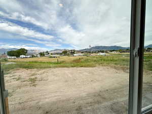 Surrounding community featuring a mountain view and a view of rural / pastoral area