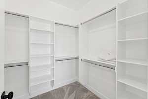 Primary bedroom walk-in closet