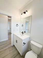 Bathroom featuring vanity and light wood-style flooring