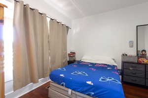 Bedroom featuring wood finished floors
