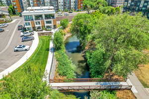 Aerial view of a large body of water and apartment complex / building