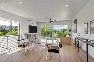 Dining room featuring light wood-style floors, a ceiling fan, and recessed lighting