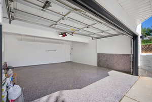 Garage featuring a garage door opener