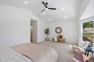 Bedroom with lofted ceiling, light carpet, recessed lighting, and ceiling fan