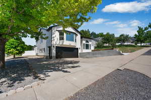 View of front of house featuring driveway and a garage