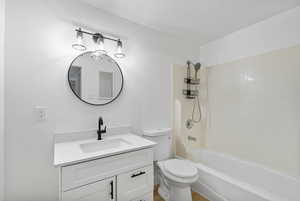 Bathroom featuring vanity and shower / washtub combination