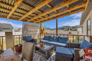Fenced backyard with a residential view and an outdoor living space