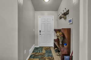 Entryway featuring baseboards