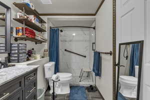 Full bath featuring vanity, curtained shower, and wood tiled floors