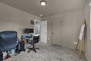 Office with carpet and baseboards