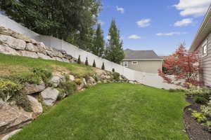 View of fenced backyard