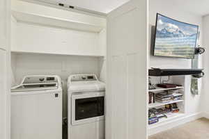 Washroom featuring washer and clothes dryer