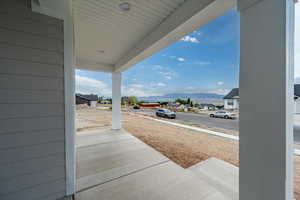 Porch featuring a mountain view