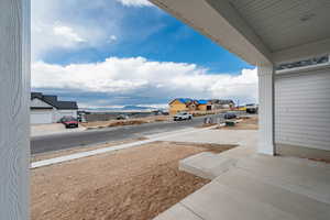 View of yard featuring covered porch