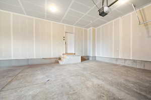 Garage featuring a garage door opener