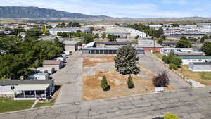 Aerial perspective of suburban area with a mountain backdrop
