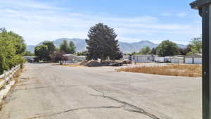 View of asphalt road with a mountain view and a residential view