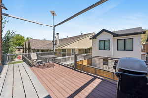 Wooden deck featuring grilling area