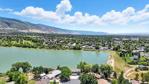 Aerial perspective of suburban area with a water and mountain view