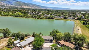 Aerial perspective of suburban area featuring a water and mountain view