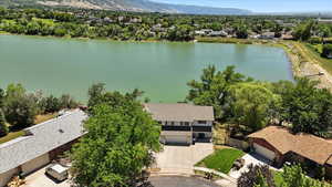 Aerial view of residential area featuring a water and mountain view