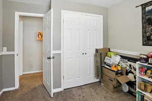 Office with carpet and baseboards