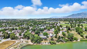 Aerial perspective of suburban area with a water and mountain view